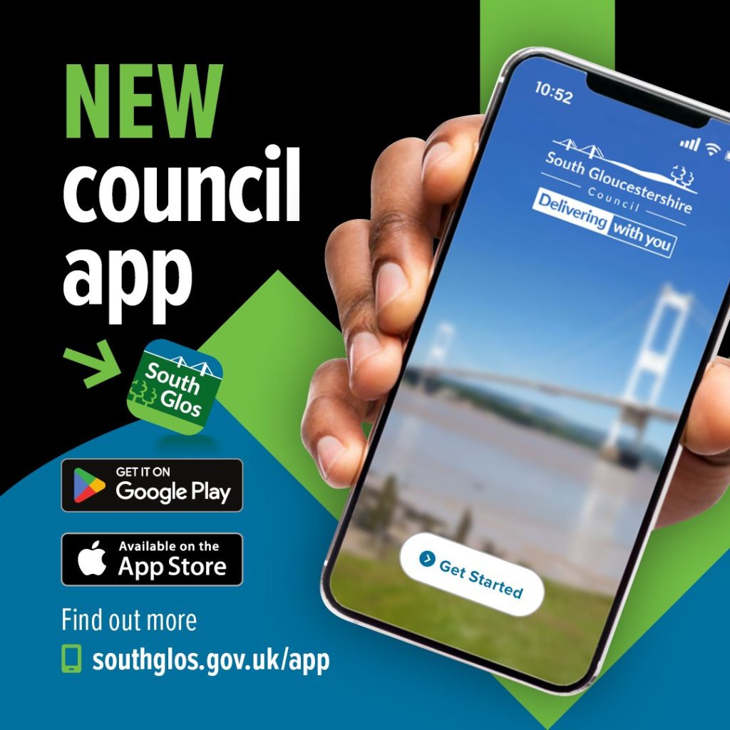 A smartphone being held by a hand, you can't see who is holding it.  The purpose of the image is to advertise the new South Glos council app,